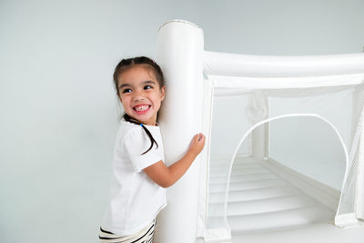 Double Hop n Play mini indoor jumping castle bundle set up in lounge