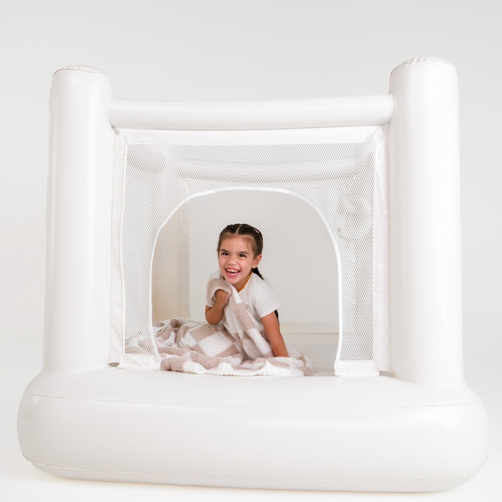 Compact bounce houses side by side for siblings